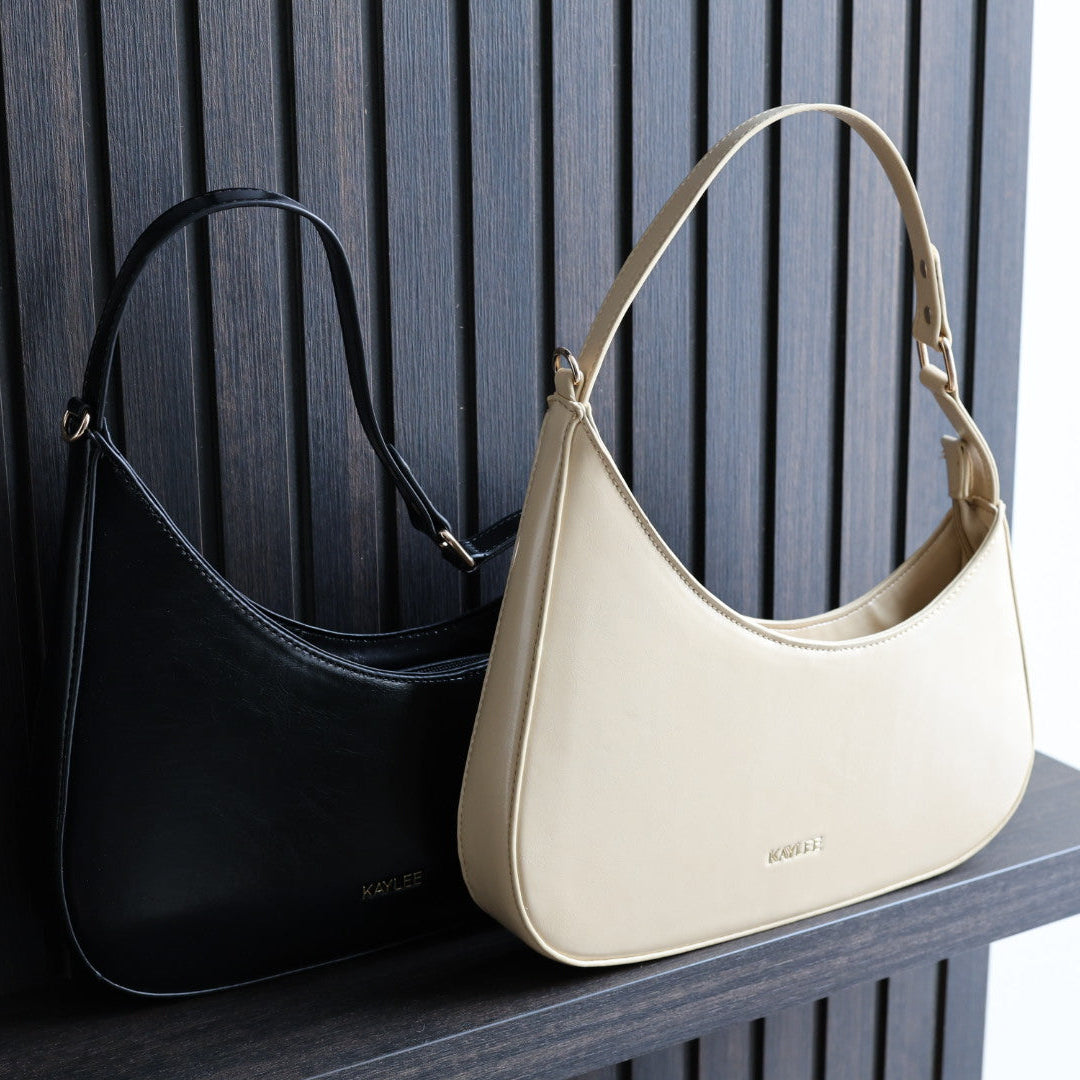Compacte handtas in beige en zwart, party proof crossbodytas