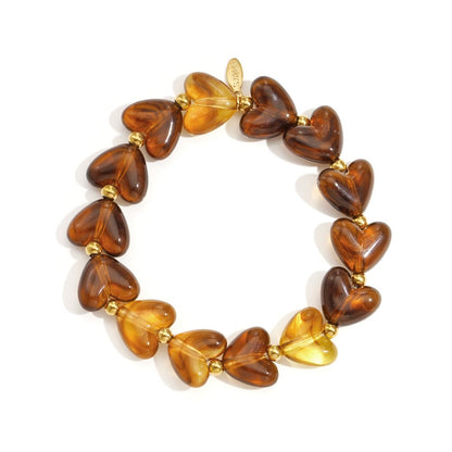 Strecht armband kralen met hartjes bruin