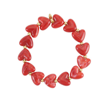Strecht armband kralen met hartjes rood